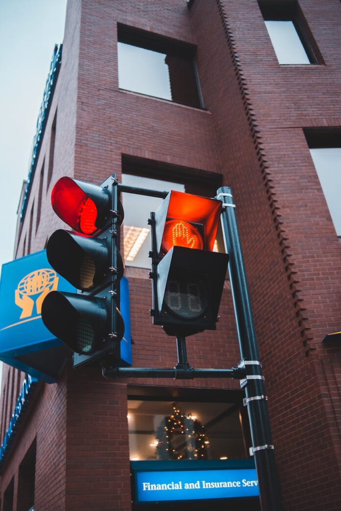 traffic lights against modern building exterior in city
